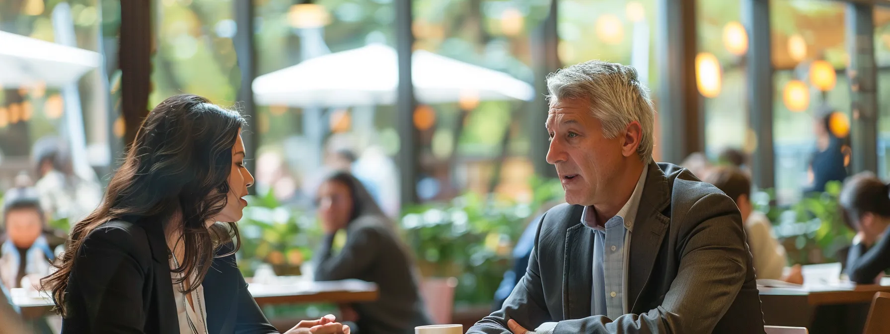 business professionals engage in a focused discussion at a restaurant management school.